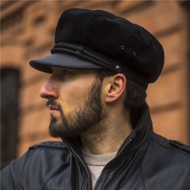 A vintage Harely style motorcycle hat made of corduroy and leather